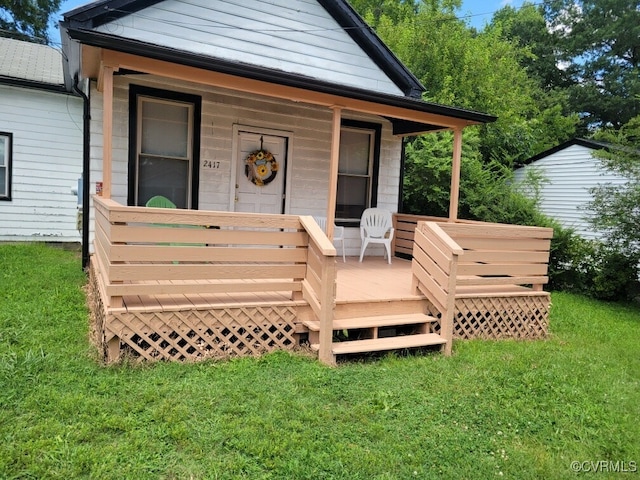 exterior space featuring covered porch and a front yard