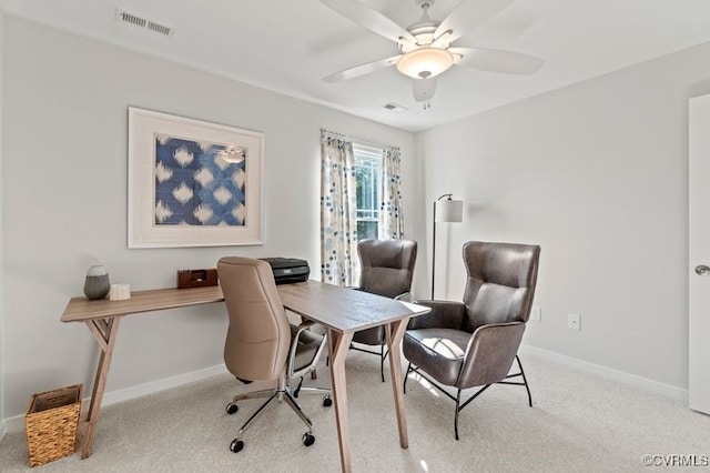 office space featuring light colored carpet and ceiling fan