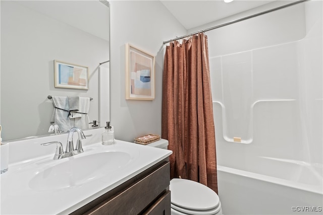 full bathroom with shower / tub combo with curtain, vanity, and toilet