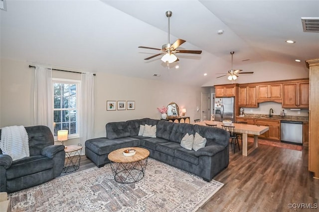 living room featuring dark hardwood / wood-style floors, ceiling fan, lofted ceiling, and sink