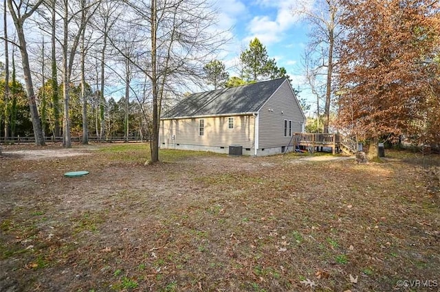 view of home's exterior with central air condition unit and a wooden deck