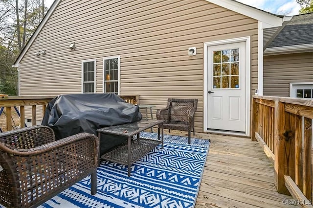 wooden deck with area for grilling