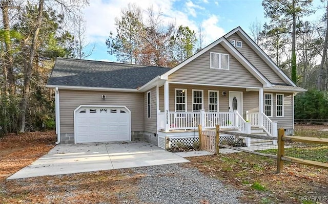 view of front of house featuring covered porch and a garage