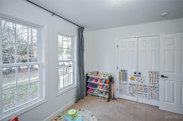 playroom featuring light carpet