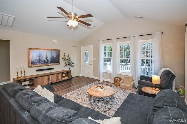 living room featuring hardwood / wood-style floors, ceiling fan, and vaulted ceiling