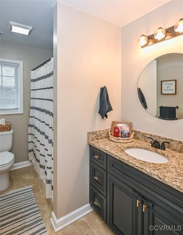 bathroom featuring tile patterned floors, vanity, curtained shower, and toilet