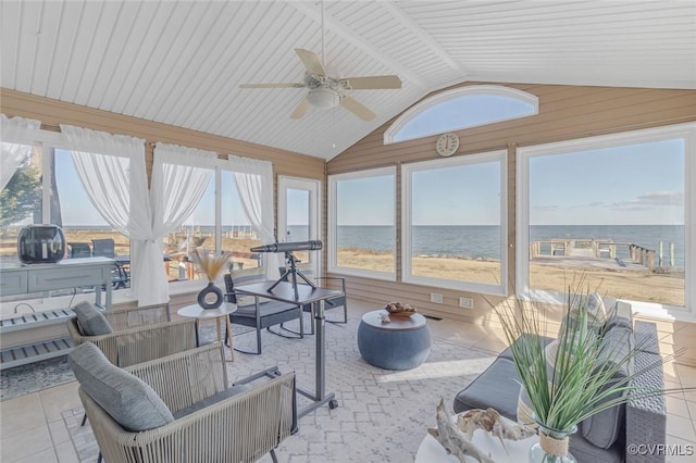 sunroom featuring ceiling fan, a water view, and lofted ceiling