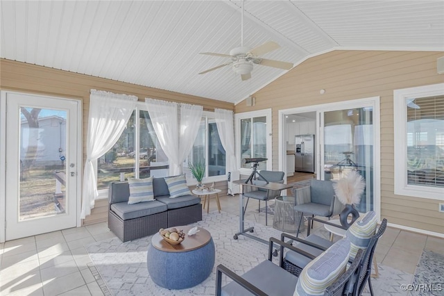 sunroom / solarium with ceiling fan and vaulted ceiling