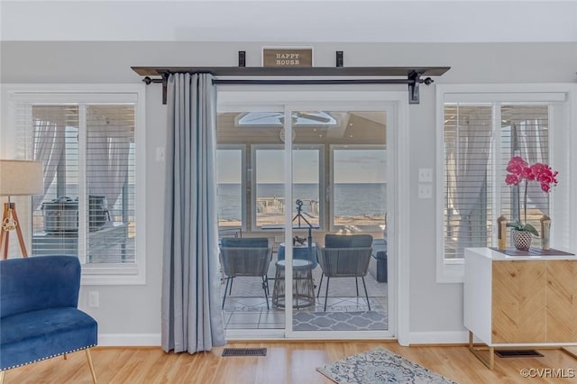 entryway with hardwood / wood-style flooring