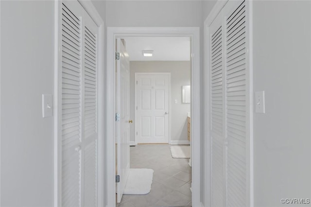 hallway featuring light tile patterned floors