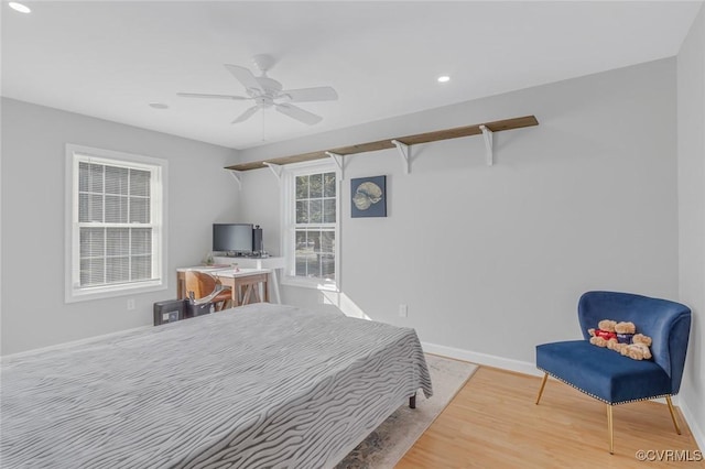 bedroom featuring hardwood / wood-style flooring and ceiling fan