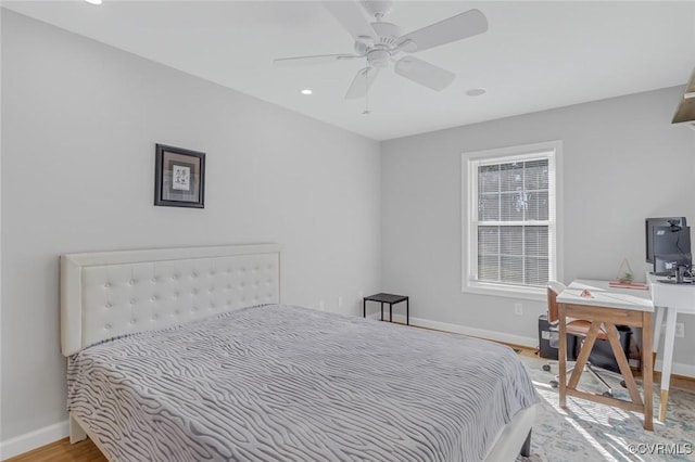 bedroom featuring light wood-type flooring and ceiling fan