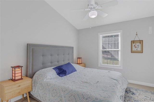 bedroom with ceiling fan, carpet, and vaulted ceiling