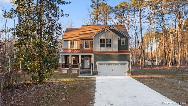 view of front of home featuring a porch and a garage