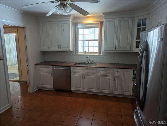 kitchen featuring sink, stainless steel appliances, and white cabinetry