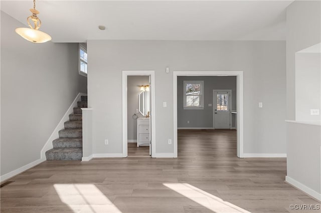 unfurnished living room featuring wood-type flooring