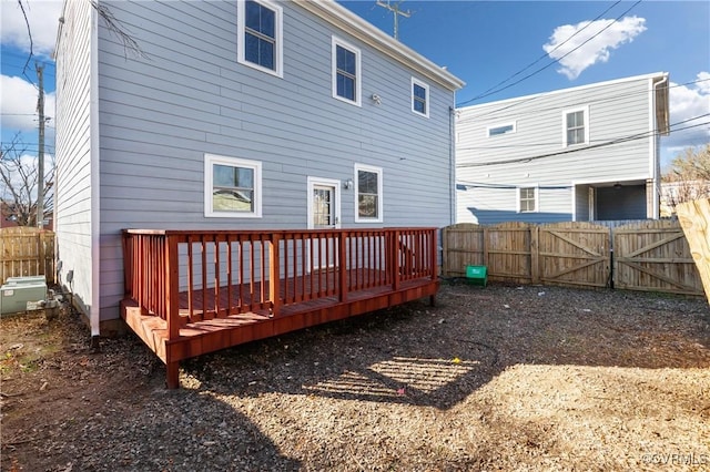 rear view of house with a wooden deck