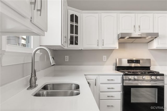 kitchen featuring white cabinetry, sink, and stainless steel gas range