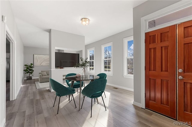 dining room with light hardwood / wood-style flooring