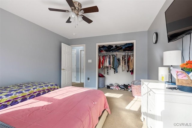 carpeted bedroom featuring a ceiling fan and a closet