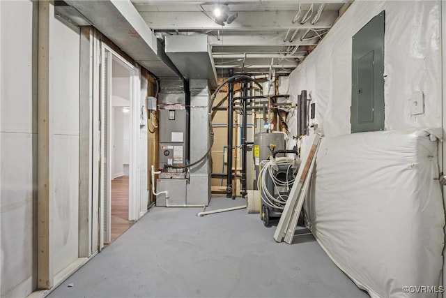 utility room with heating unit, water heater, and electric panel