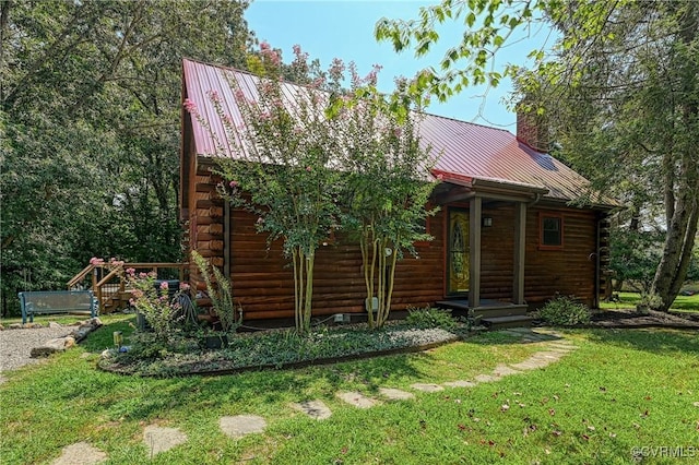 log home with a front yard