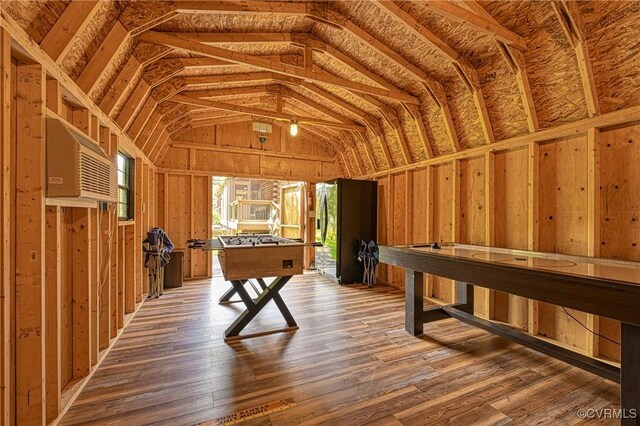 game room with hardwood / wood-style flooring and lofted ceiling