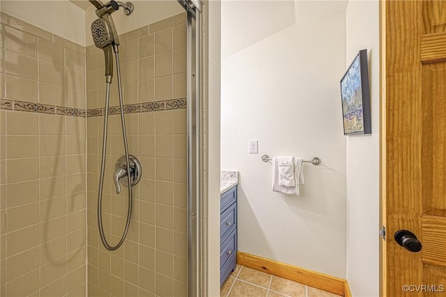 bathroom with vanity and a tile shower