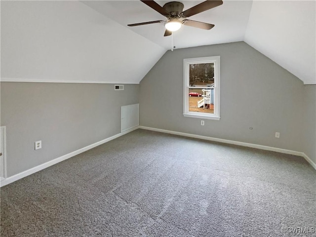 additional living space featuring carpet flooring, ceiling fan, and vaulted ceiling