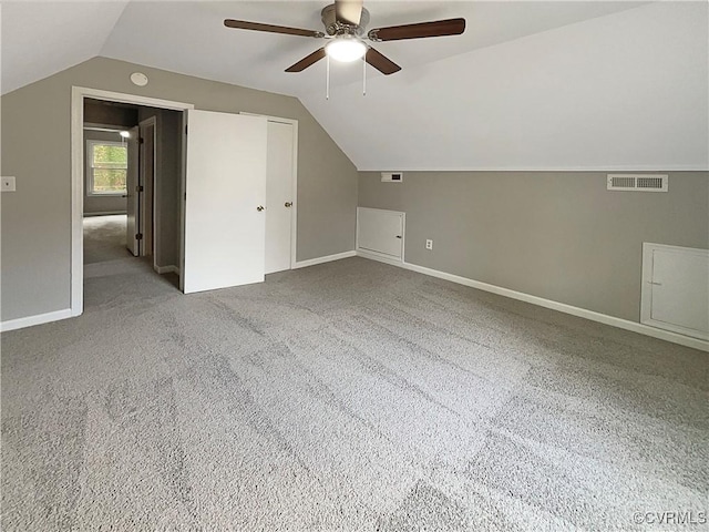 bonus room with carpet, vaulted ceiling, and ceiling fan