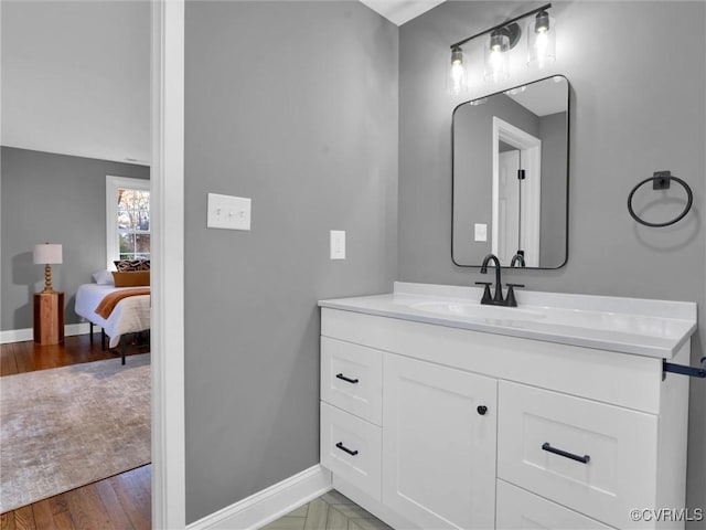 bathroom with wood-type flooring and vanity