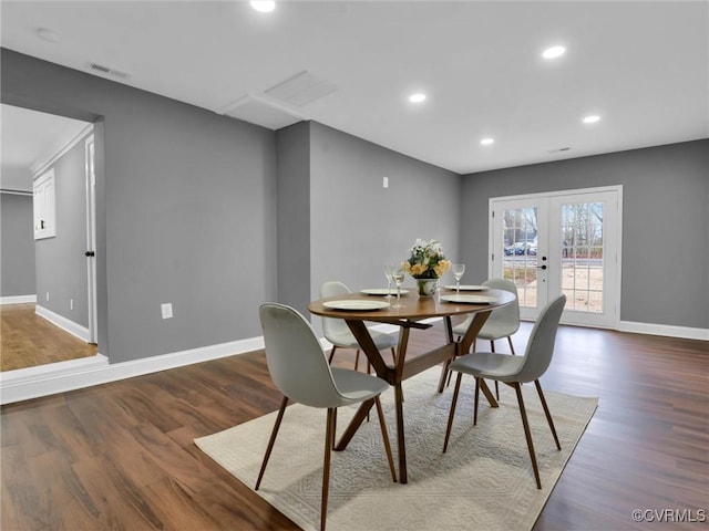 dining area with french doors and dark hardwood / wood-style flooring