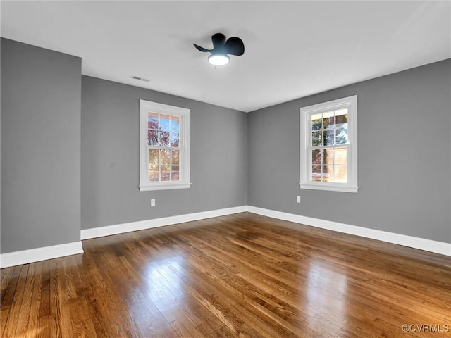 empty room with dark wood-type flooring