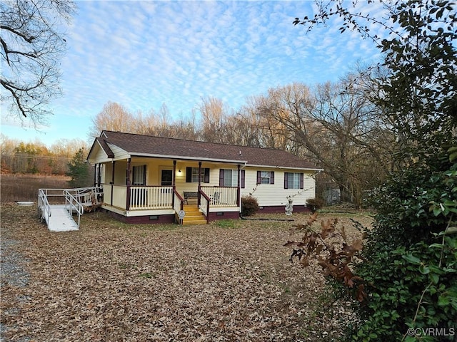 single story home featuring covered porch