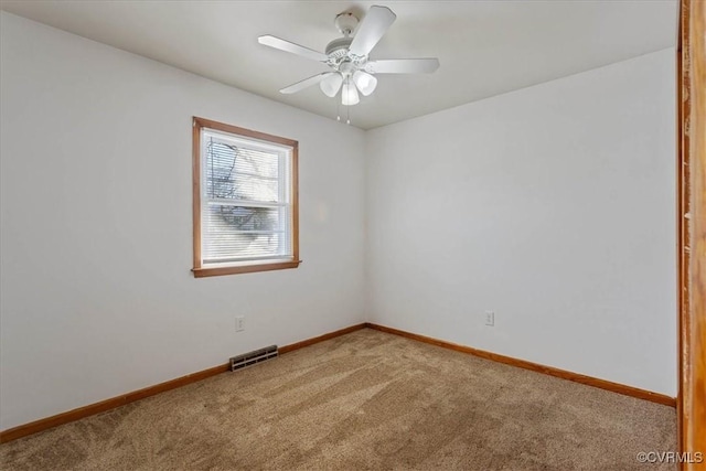 unfurnished room featuring carpet flooring and ceiling fan