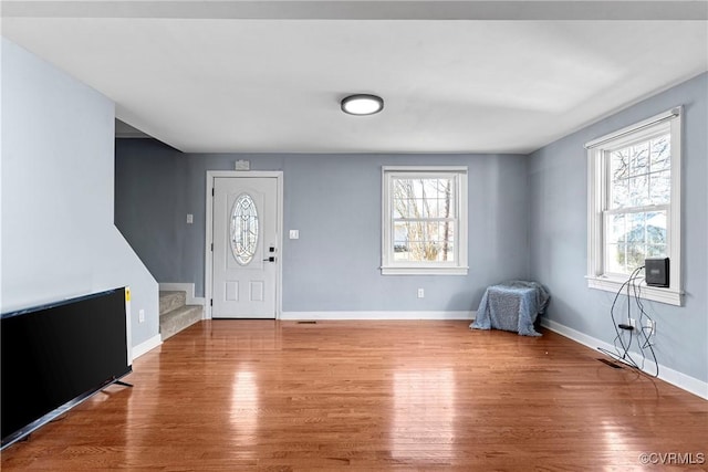 foyer featuring hardwood / wood-style flooring and a wealth of natural light