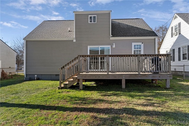 back of house with a yard and a wooden deck