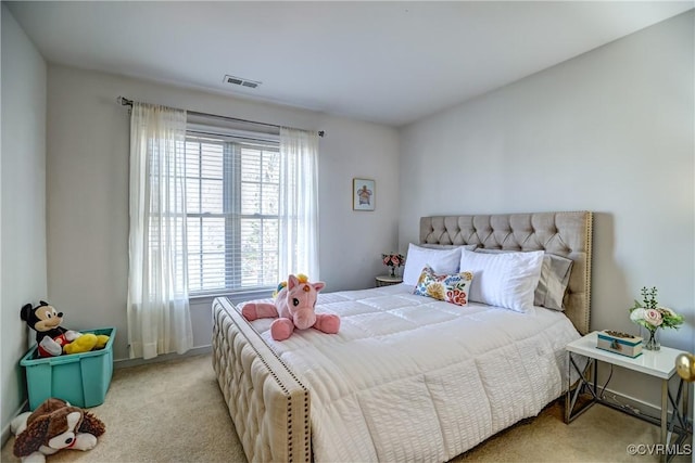 bedroom featuring light carpet