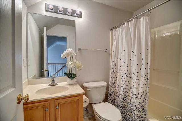 full bathroom with shower / tub combo, vanity, and toilet