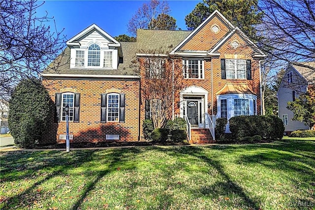 front facade with a front yard