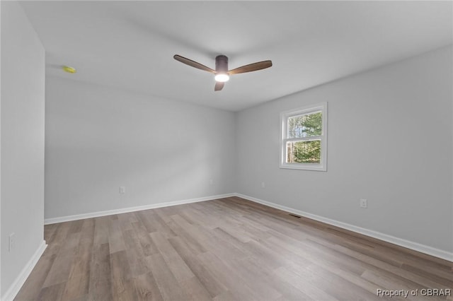 unfurnished room featuring ceiling fan and light hardwood / wood-style floors