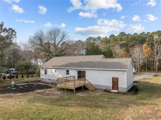 back of house with a yard and a wooden deck