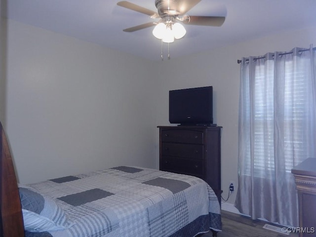 bedroom featuring hardwood / wood-style flooring and ceiling fan