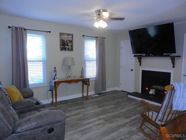 living room with ceiling fan, hardwood / wood-style flooring, and a healthy amount of sunlight