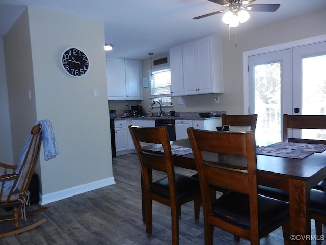 dining space with dark wood-type flooring, ceiling fan, and french doors