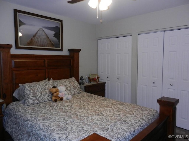 bedroom with multiple closets and ceiling fan