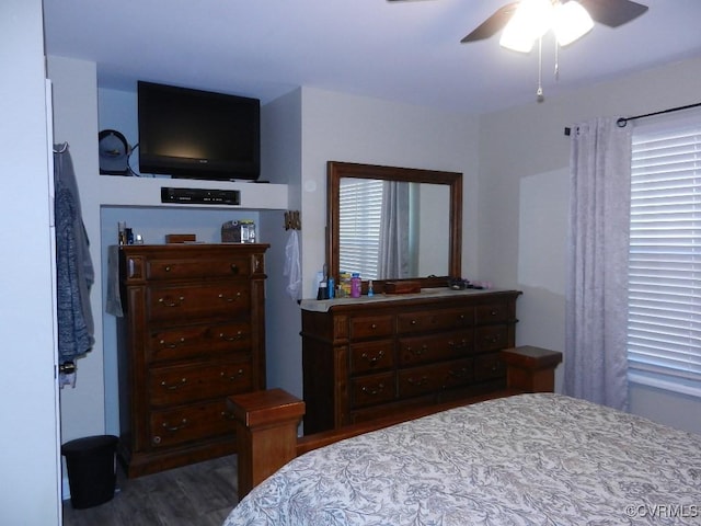 bedroom featuring dark hardwood / wood-style floors and ceiling fan