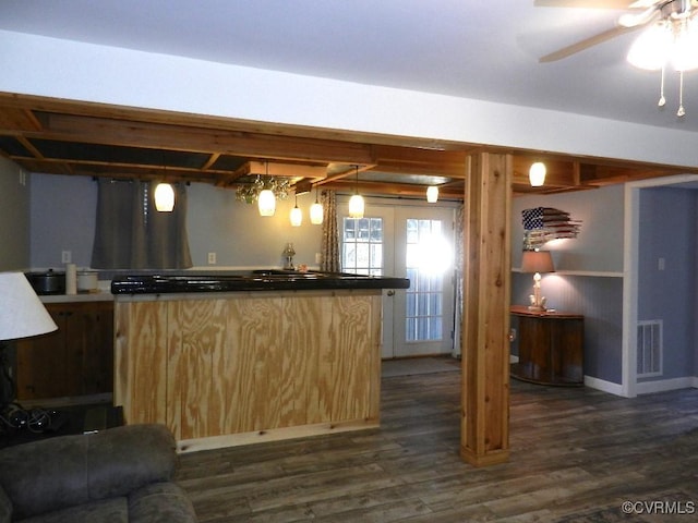 kitchen featuring hanging light fixtures, dark hardwood / wood-style floors, ceiling fan, and light brown cabinets