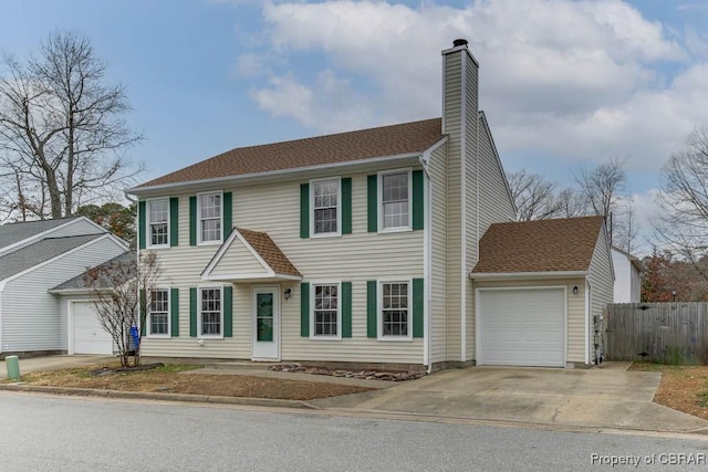 colonial inspired home featuring a garage