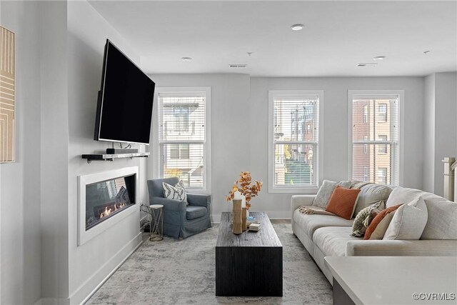 living room featuring a wealth of natural light